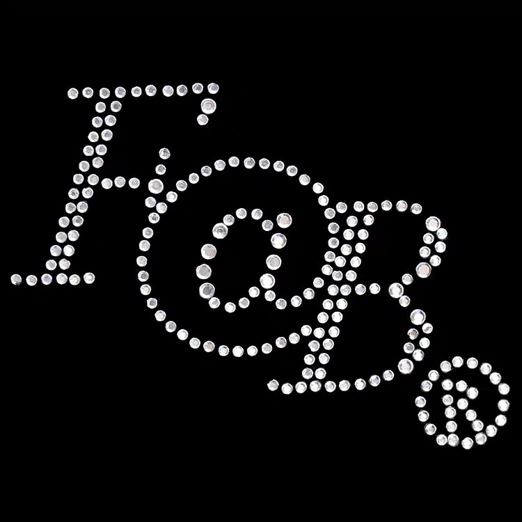 A monogram in clear rhinestones, a StudStone heat transfer