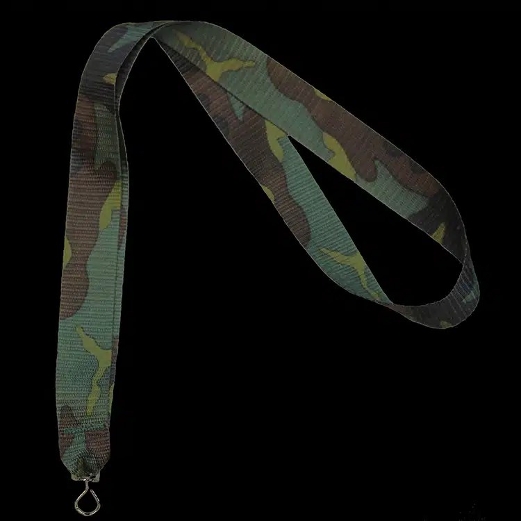 Camouflage print polyester lanyard in olive, brown and tan, laid out on black.