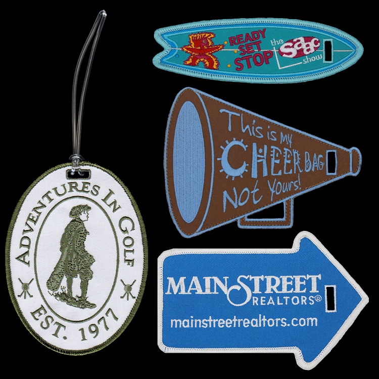 Four custom shape embroidered luggage tags in an oval, a surfboard, a megaphone and an arrow shape.
