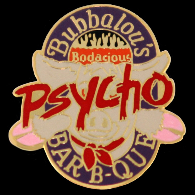 Cloisonne hard enamel lapel pin with a mascot figure, in red and tan enamel with raised metal walls.