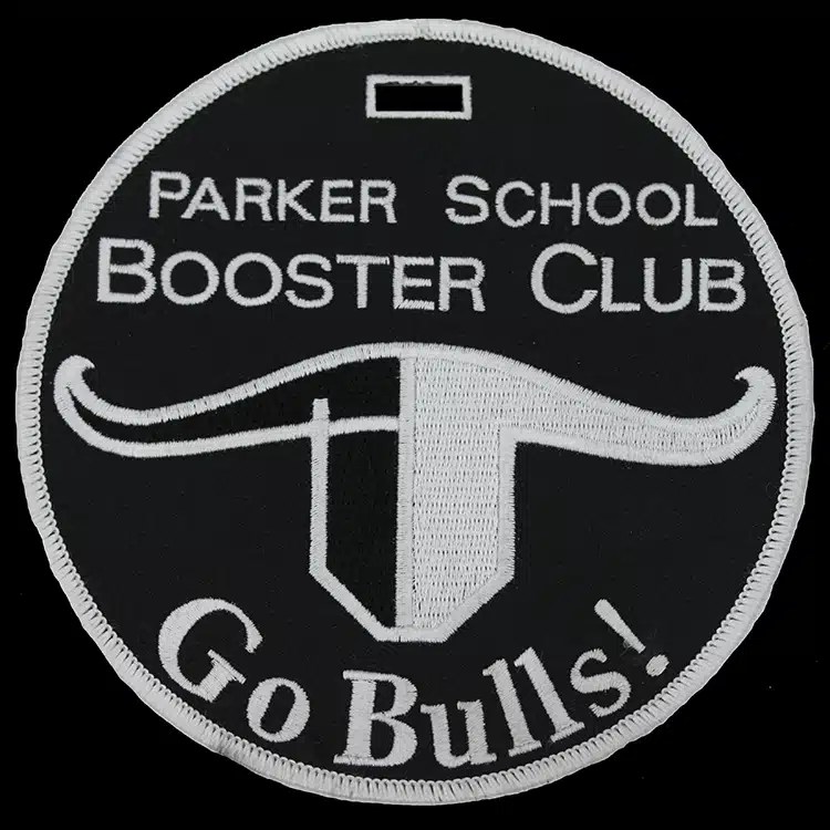 Round embroidered luggage tag for Parker School Booster Club, white longhorn design on black twill.