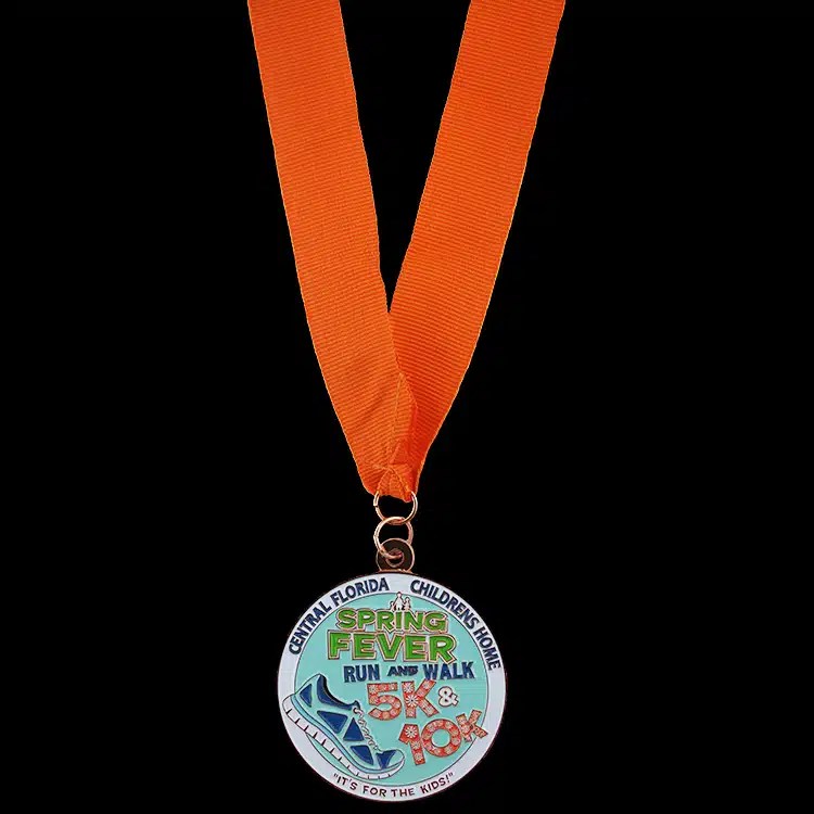 Full colour enamel finisher medal on a printed orange neck ribbon.
