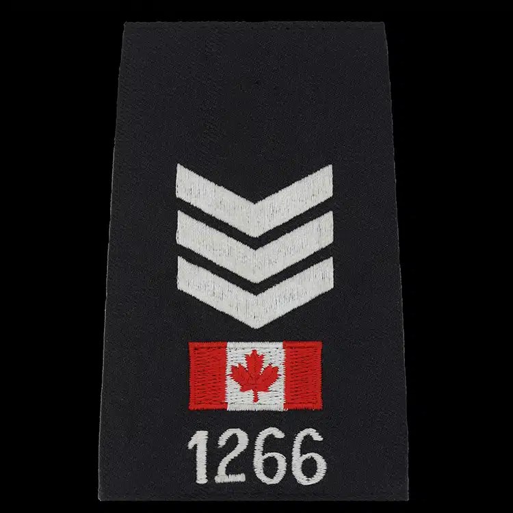 Black epaulet cover embroidered with three white chevrons, a small red and white flag and a white number.