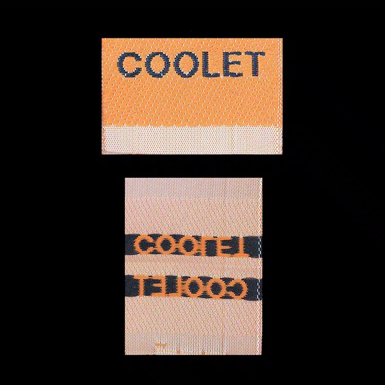 Coolet woven labels, front and back, Manhattan cut fold, orange lettering on peach.